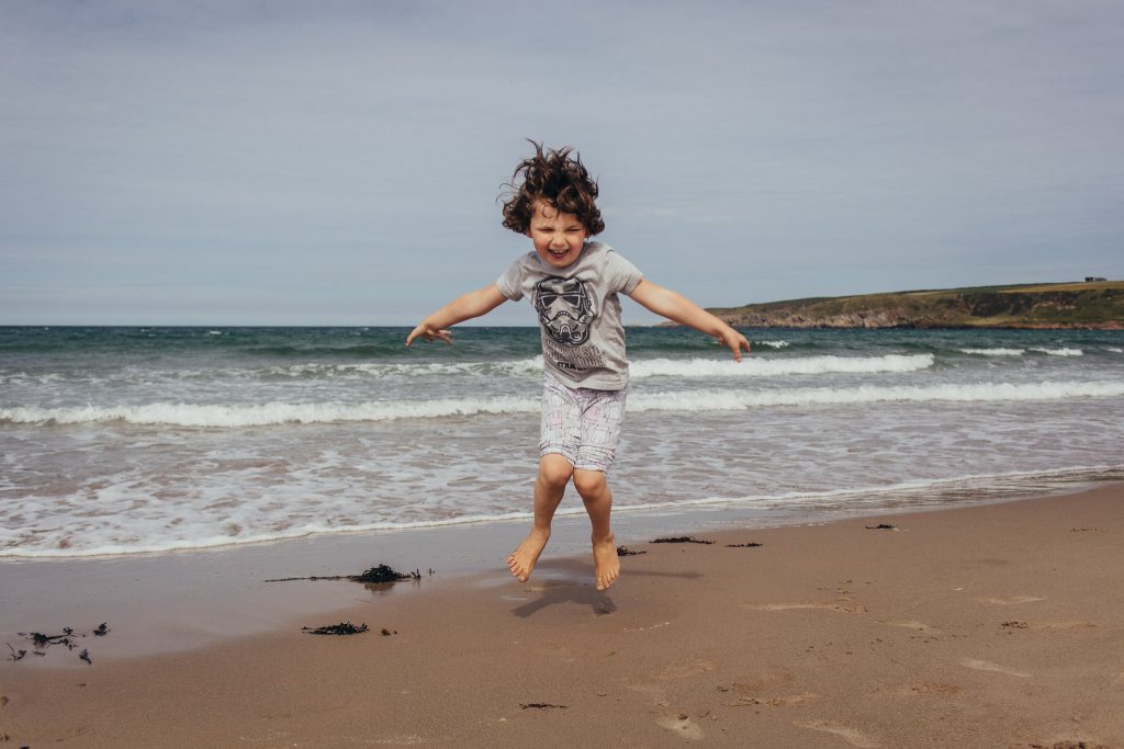 Hiding in sand dunes at Sandend Beach - Debbie Dee Photography - Aberdeenshire family photography