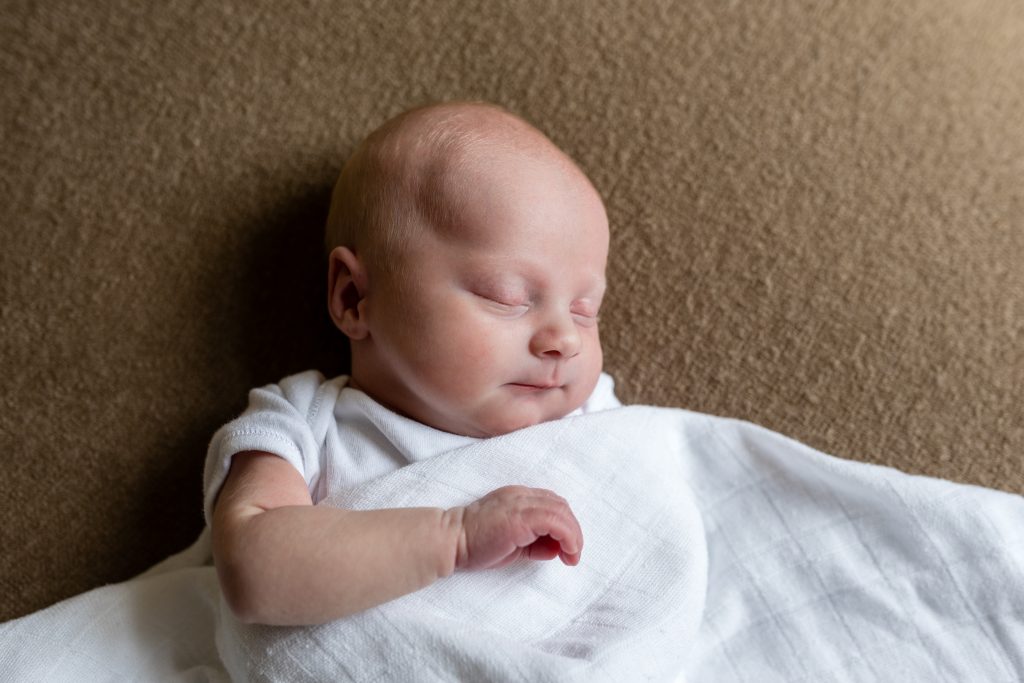 Baby in swaddle on brown blanket - Newborn baby photographer - aberdeen aberdeenshire - Debbie Dee Photography